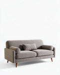 Grijze stoffen bank met twee kussens en houten poten 190 x 80 x 85cm